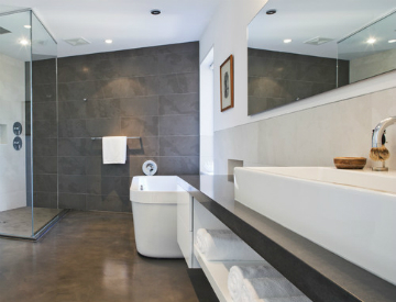 Concrete, pebble tile, and linoleum are three eco-friendly bathroom floor materials that we recommend for your home.  Source: Houzz
